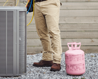 Someone working on an AC unit